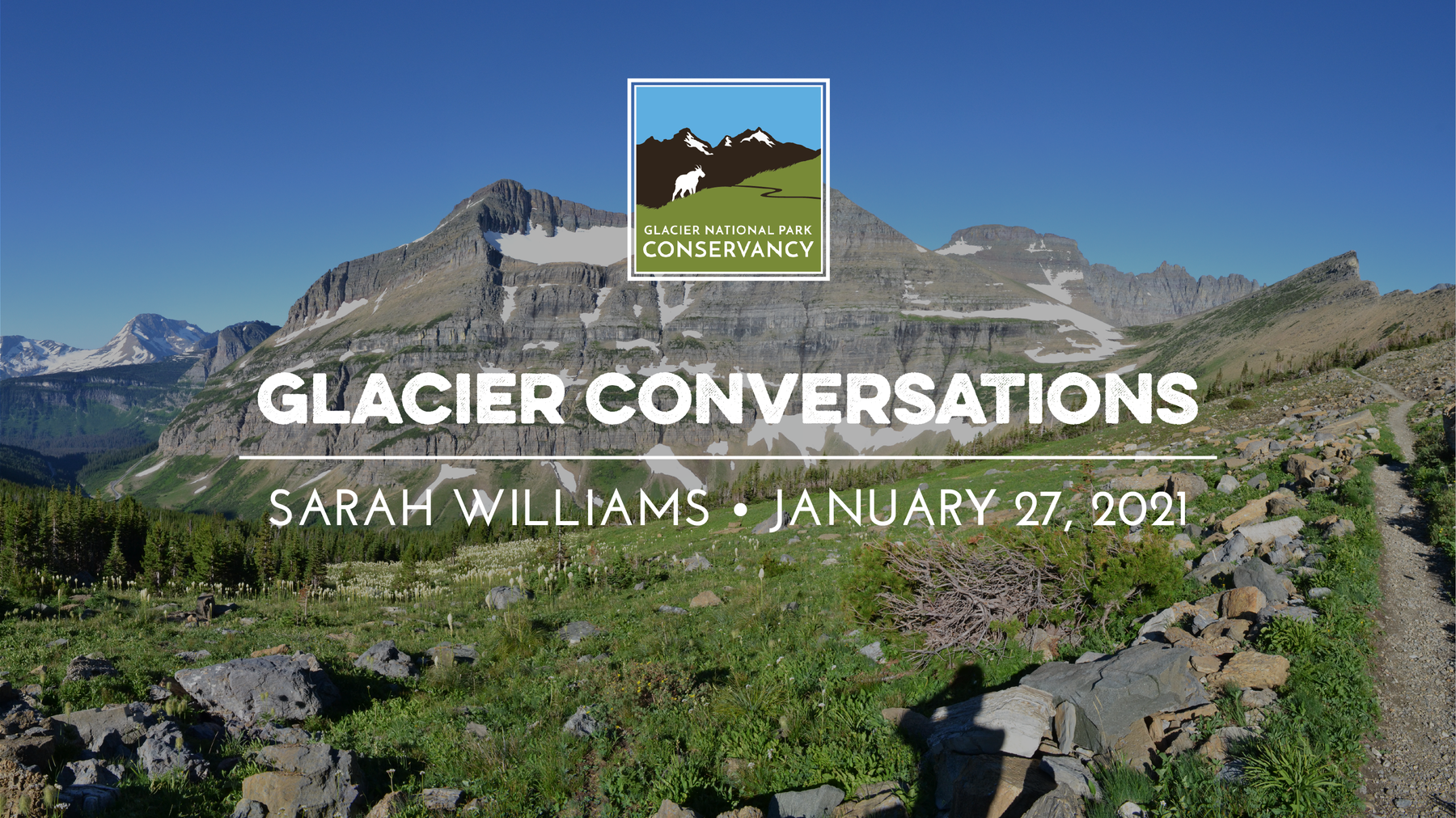 A trail winds along a lush alpine meadow at the foot of a snowcapped mountain and text that reads, "Glacier Conservations, Sarah Williams, January 27, 2021"